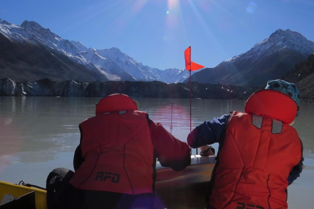 UC students conducting a geospatial data survey of a lake.