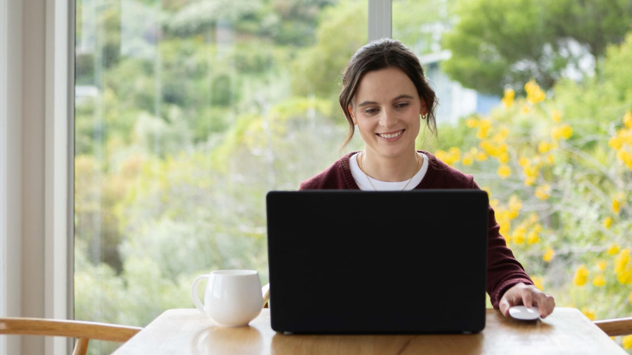 Mother studying online with Tuihono UC | UC Online from home with daughter and dog