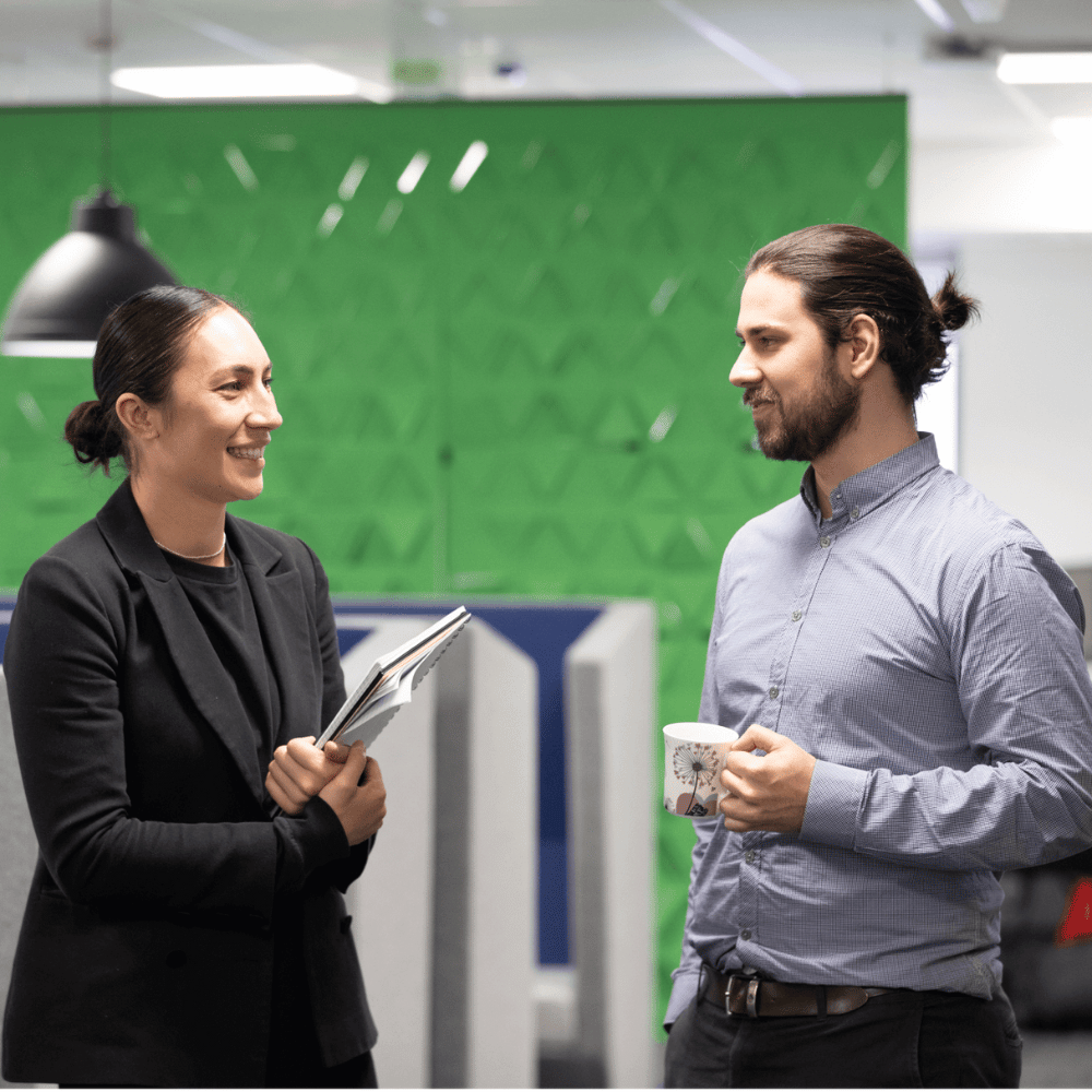 Two justice workers discussing their online criminal justice study