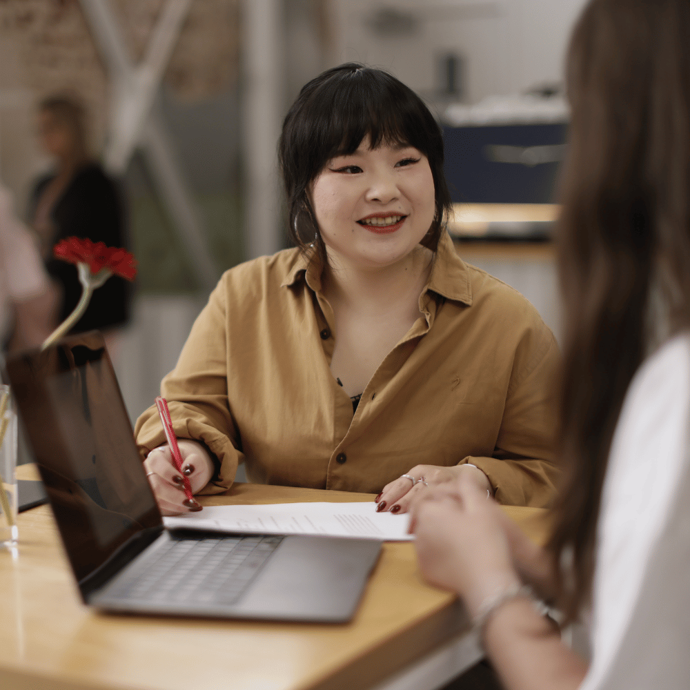 Student on her laptop starting her first project management course focused on agile methodology.