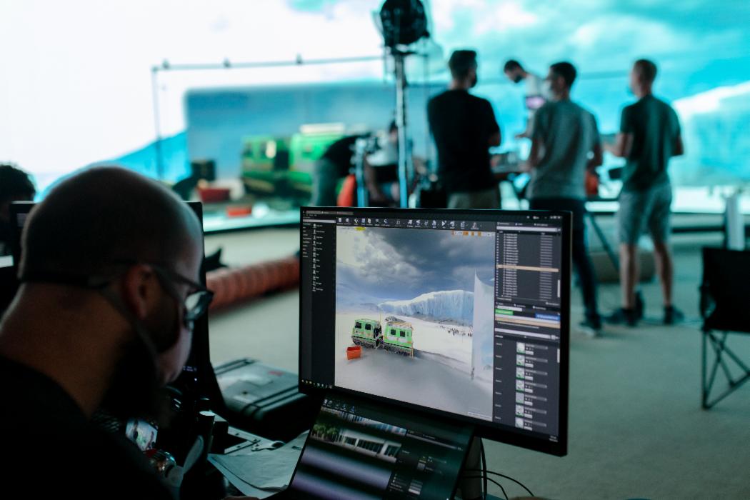Filmmakers on UC's Virtual Screen Production stage filming a scene set in Antarctica.