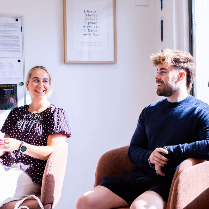 Two psychology postgraduate students smiling