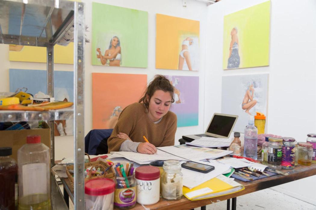 Fine Arts student drawing in their studio space.