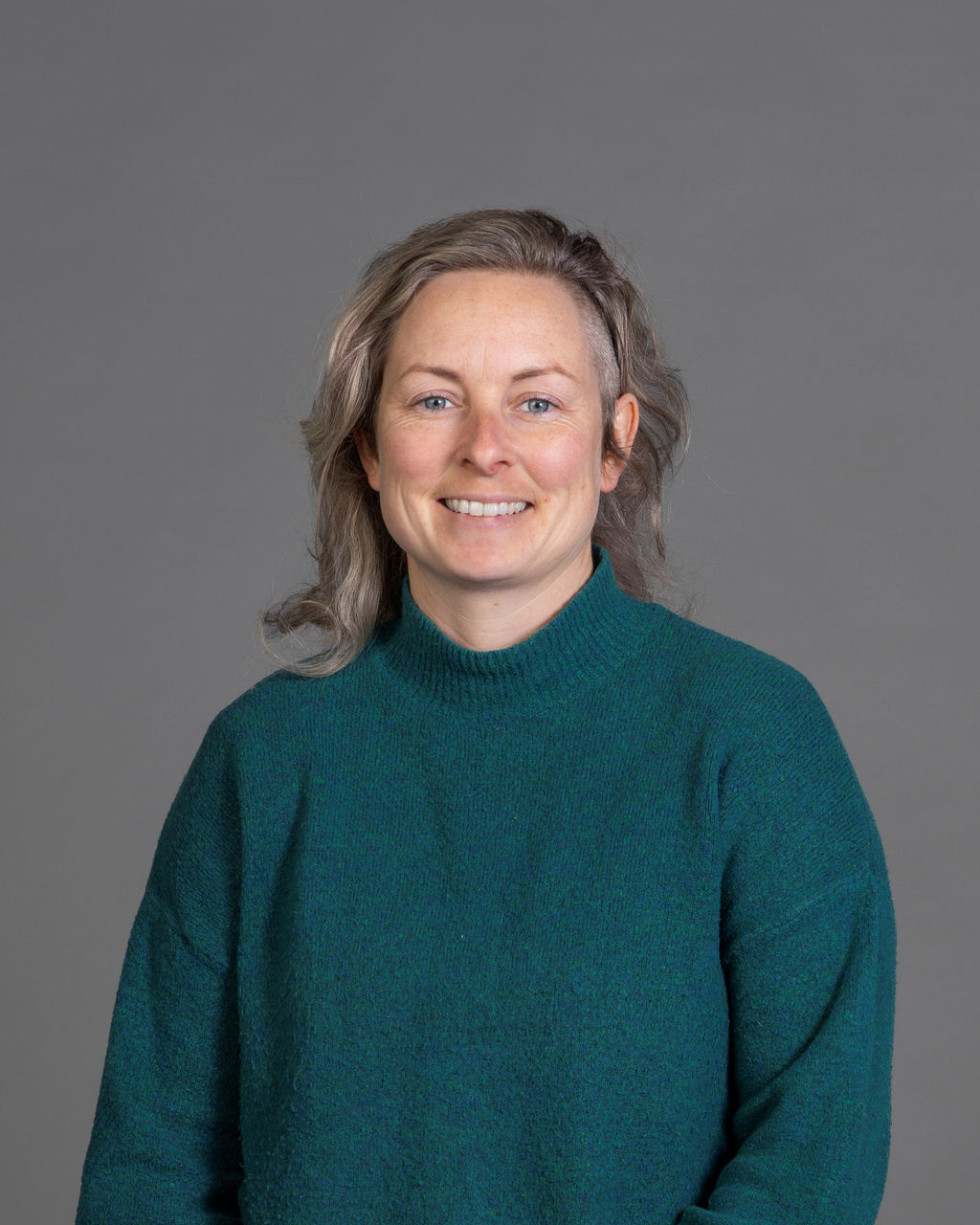 Portrait image of staff member Jam Kelly