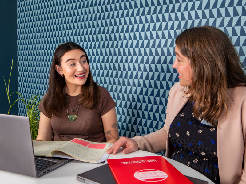 Research student advisor talking with student