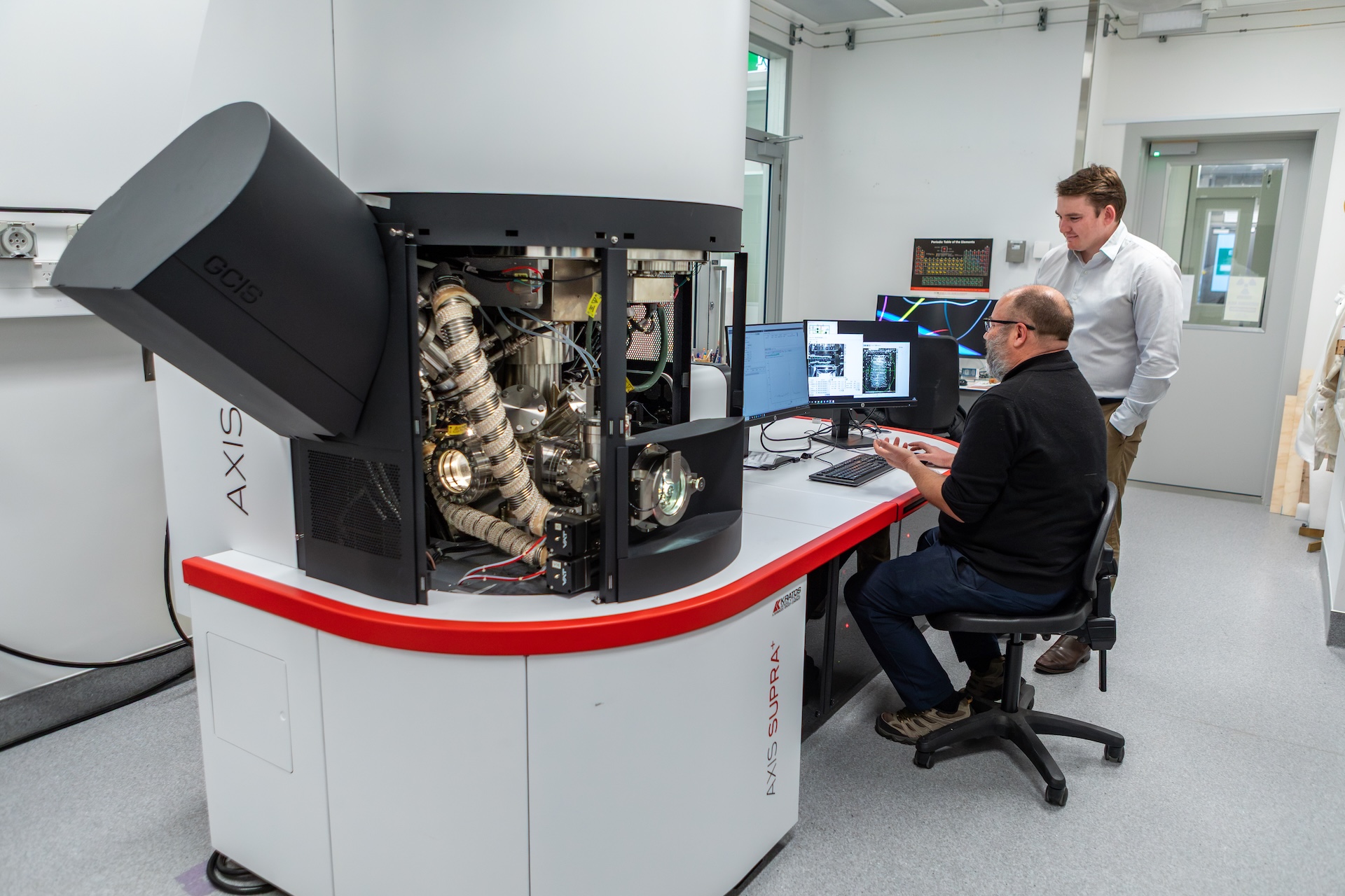 Researchers using a machine for x-ray photoelectron spectroscopy.