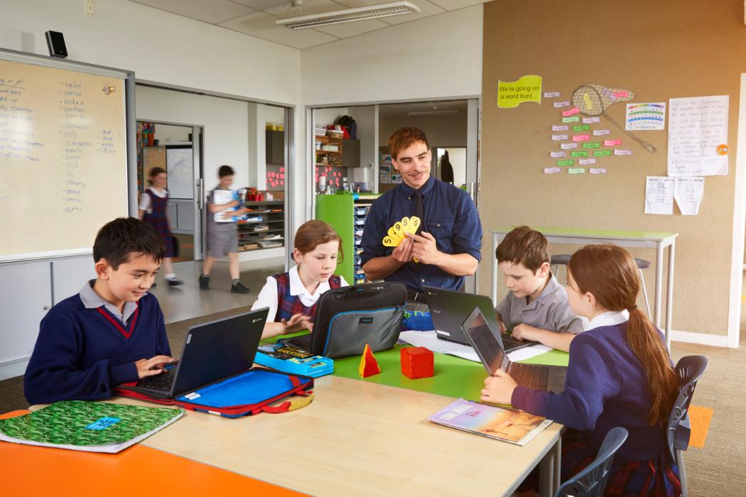 student teacher and students in a school