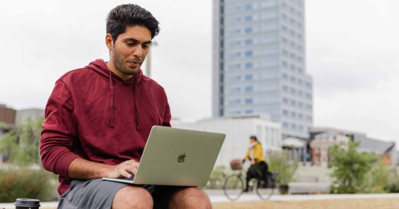 Learner studying applied data science outside with the flexibility of Tuihono UC | UC Online