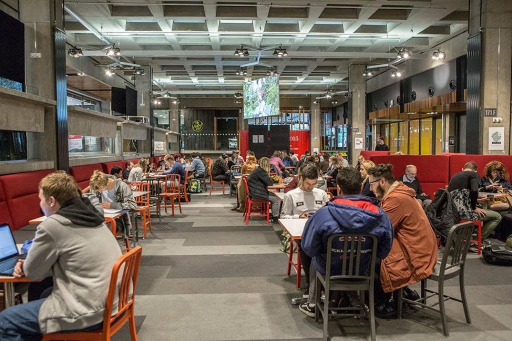 Students sitting at tables in the food court at Canterbury University's Undercroft