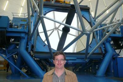Dr Stuart Ryder in front of one of the twin 8.1-metre Gemini telescopes located on Cerro Pachón, Chile.
