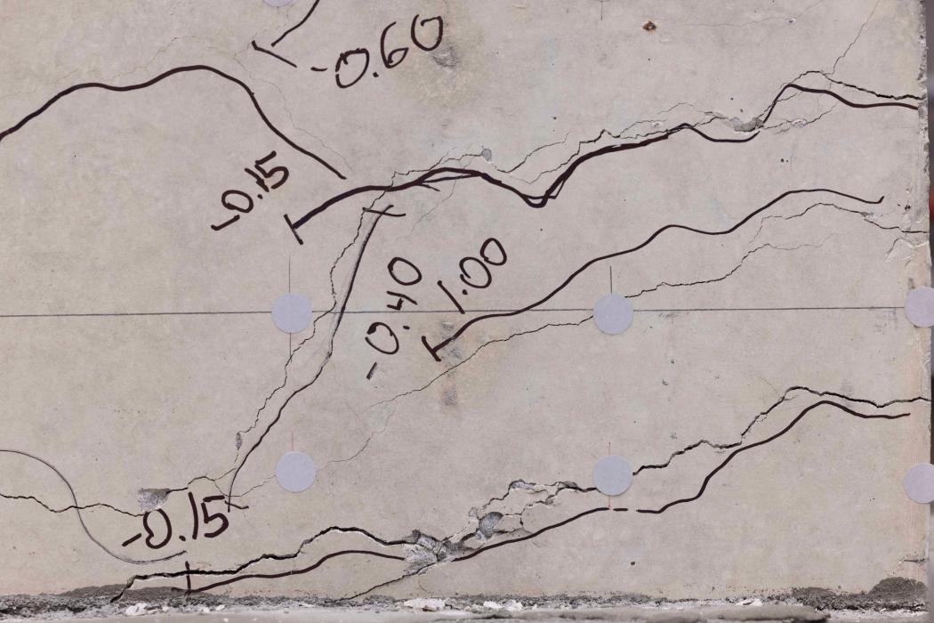 The lines mark the cracks after three days of seismic testing on the concrete wall.