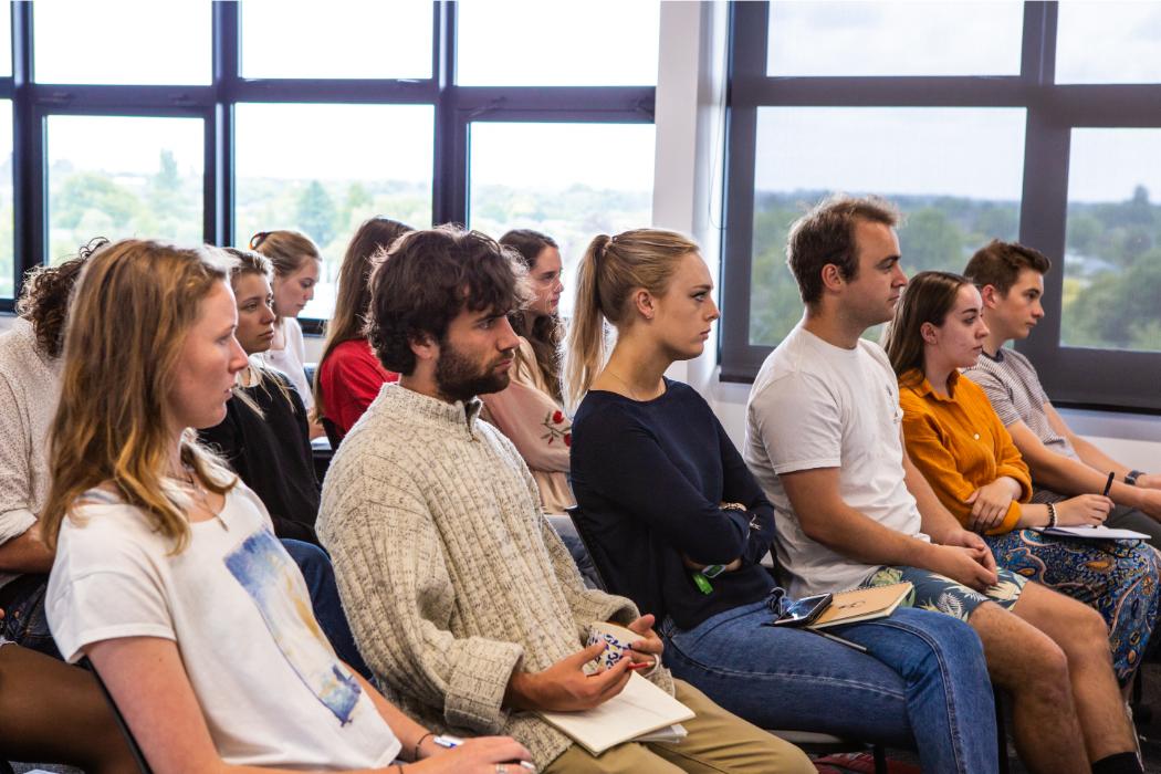 Stephanie Beattie and Kaspar Soltero (on left) taking in the wisdom of one of our workshop speakers.