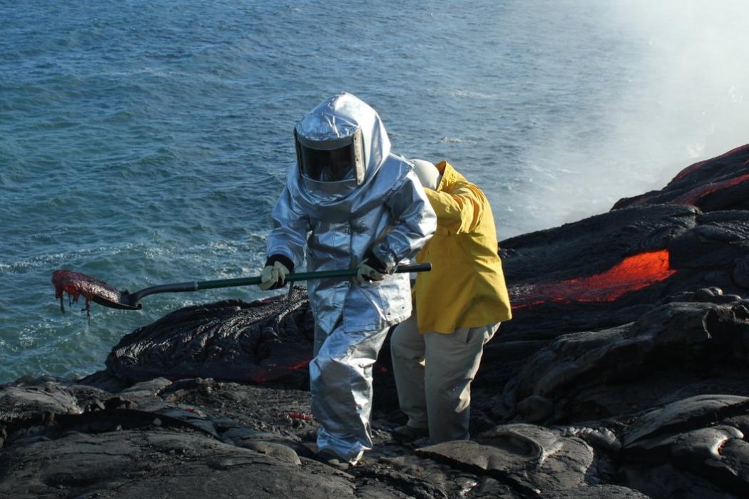 Ben Kennedy sampling lava at Kilauea volcano in Hawaii. Lava has an intriguing temperature dependent rheology