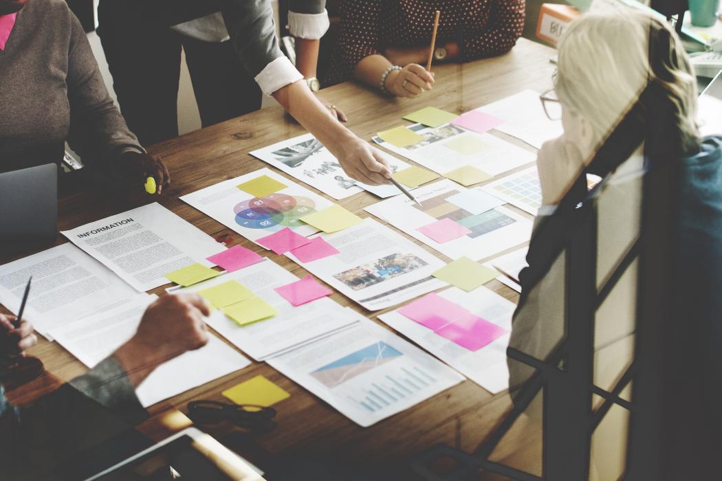 People around table with documents