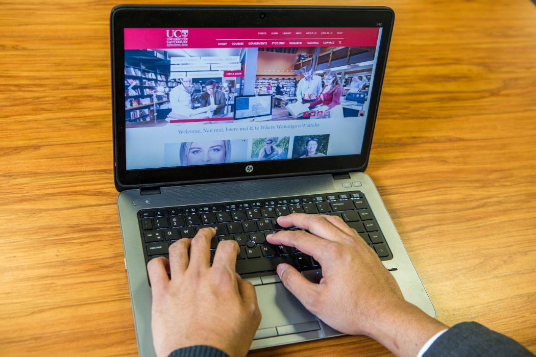 Hands typing on a laptop College of Education