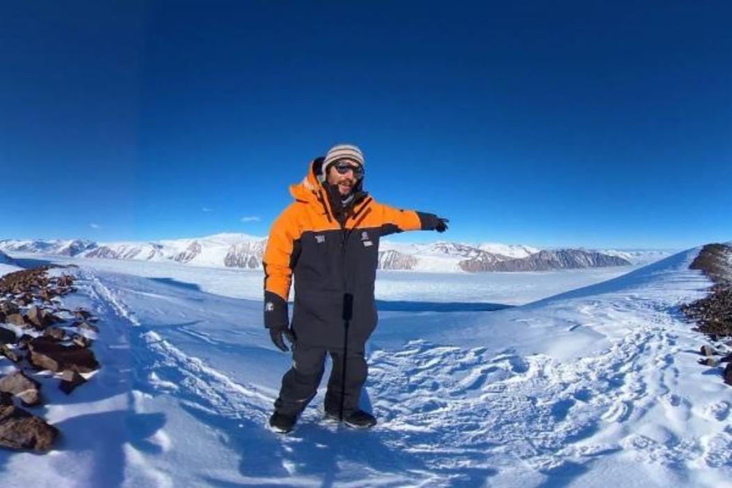 Man Standing in Snowy Landscape