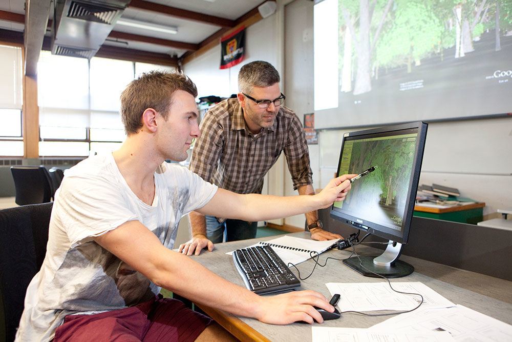 Forestry students undertaking software instruction and conducting analysis